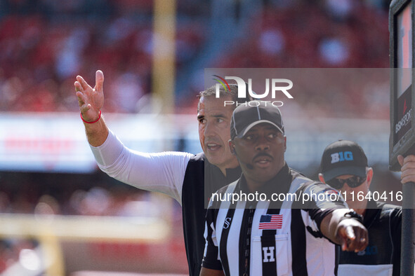 Wisconsin Badgers Head Coach Luke Fickell pleads his case against the Purdue Boilermakers at Camp Randall Stadium in Madison, Wisconsin, on...