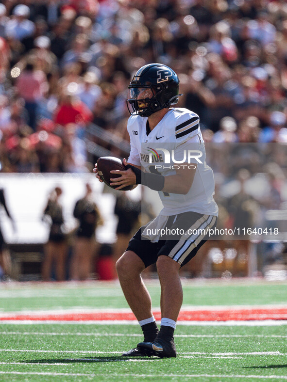 Purdue Boilermakers quarterback Hudson Card #1 takes a snap against the Wisconsin Badgers at Camp Randall Stadium in Madison, Wisconsin, on...