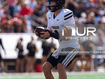 Purdue Boilermakers quarterback Hudson Card #1 takes a snap against the Wisconsin Badgers at Camp Randall Stadium in Madison, Wisconsin, on...