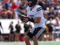 Purdue Boilermakers quarterback Hudson Card #1 takes a snap against the Wisconsin Badgers at Camp Randall Stadium in Madison, Wisconsin, on...