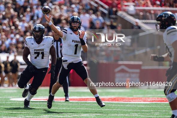 Purdue Boilermakers quarterback Hudson Card #1 throws a pass against the Wisconsin Badgers at Camp Randall Stadium in Madison, Wisconsin, on...