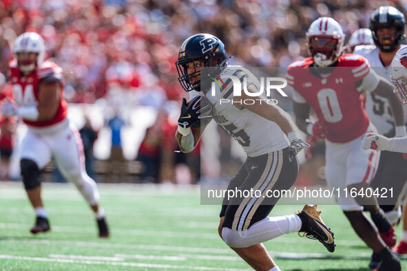 Purdue Boilermakers running back Devin Mockobee #45 runs upfield after a reception against the Wisconsin Badgers at Camp Randall Stadium in...