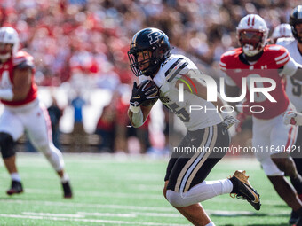 Purdue Boilermakers running back Devin Mockobee #45 runs upfield after a reception against the Wisconsin Badgers at Camp Randall Stadium in...