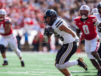 Purdue Boilermakers running back Devin Mockobee #45 runs upfield after a reception against the Wisconsin Badgers at Camp Randall Stadium in...