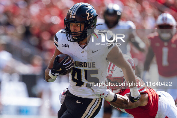 Purdue Boilermakers running back Devin Mockobee #45 runs upfield after a reception against the Wisconsin Badgers at Camp Randall Stadium in...