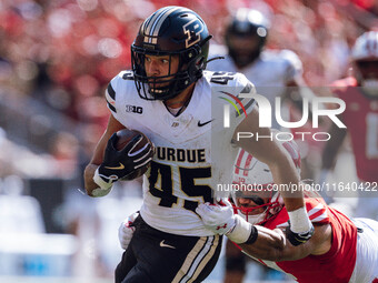 Purdue Boilermakers running back Devin Mockobee #45 runs upfield after a reception against the Wisconsin Badgers at Camp Randall Stadium in...