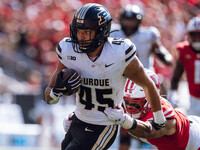 Purdue Boilermakers running back Devin Mockobee #45 runs upfield after a reception against the Wisconsin Badgers at Camp Randall Stadium in...