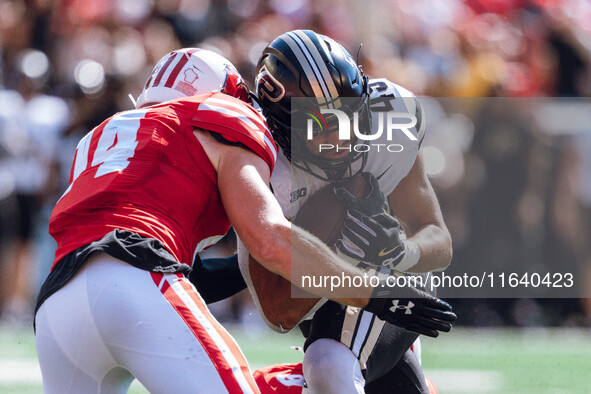 Purdue Boilermakers running back Devin Mockobee #45 runs upfield after a reception against the Wisconsin Badgers at Camp Randall Stadium in...