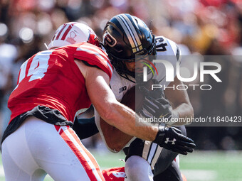 Purdue Boilermakers running back Devin Mockobee #45 runs upfield after a reception against the Wisconsin Badgers at Camp Randall Stadium in...