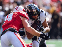 Purdue Boilermakers running back Devin Mockobee #45 runs upfield after a reception against the Wisconsin Badgers at Camp Randall Stadium in...