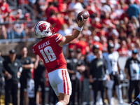 Wisconsin Badgers quarterback Braedyn Locke #18 throws a pass against the Purdue Boilermakers at Camp Randall Stadium in Madison, Wisconsin,...