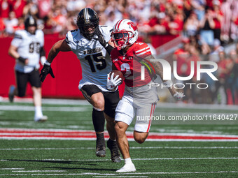 Wisconsin Badgers wide receiver Trech Kekahuna #2 outruns the Purdue Boilermakers defense for a touchdown at Camp Randall Stadium in Madison...