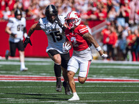 Wisconsin Badgers wide receiver Trech Kekahuna #2 outruns the Purdue Boilermakers defense for a touchdown at Camp Randall Stadium in Madison...