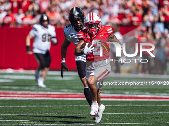 Wisconsin Badgers wide receiver Trech Kekahuna #2 outruns the Purdue Boilermakers defense for a touchdown at Camp Randall Stadium in Madison...