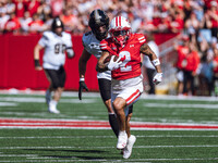 Wisconsin Badgers wide receiver Trech Kekahuna #2 outruns the Purdue Boilermakers defense for a touchdown at Camp Randall Stadium in Madison...