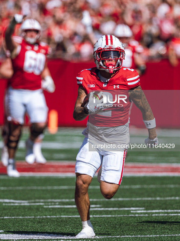 Wisconsin Badgers wide receiver Trech Kekahuna #2 outruns the Purdue Boilermakers defense for a touchdown at Camp Randall Stadium in Madison...