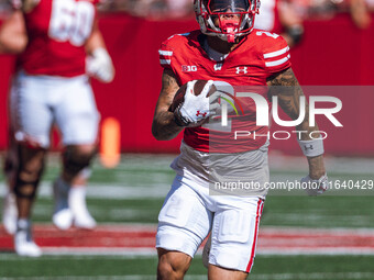 Wisconsin Badgers wide receiver Trech Kekahuna #2 outruns the Purdue Boilermakers defense for a touchdown at Camp Randall Stadium in Madison...