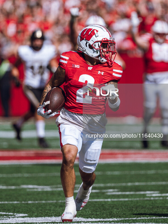 Wisconsin Badgers wide receiver Trech Kekahuna #2 outruns the Purdue Boilermakers defense for a touchdown at Camp Randall Stadium in Madison...