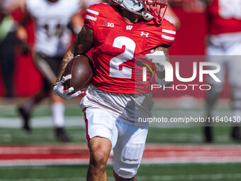 Wisconsin Badgers wide receiver Trech Kekahuna #2 outruns the Purdue Boilermakers defense for a touchdown at Camp Randall Stadium in Madison...