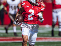 Wisconsin Badgers wide receiver Trech Kekahuna #2 outruns the Purdue Boilermakers defense for a touchdown at Camp Randall Stadium in Madison...