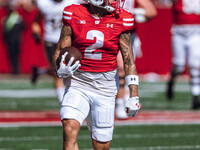 Wisconsin Badgers wide receiver Trech Kekahuna #2 outruns the Purdue Boilermakers defense for a touchdown at Camp Randall Stadium in Madison...