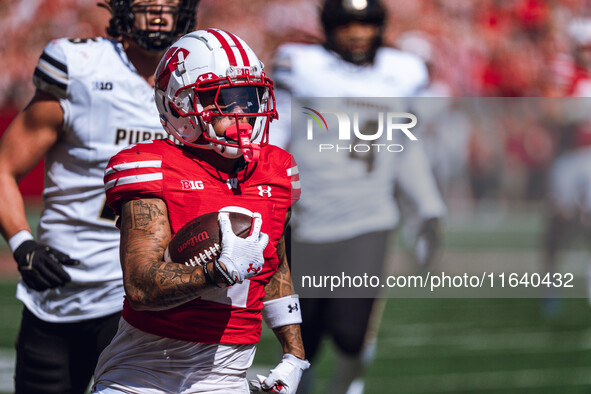 Wisconsin Badgers wide receiver Trech Kekahuna #2 outruns the Purdue Boilermakers defense for a touchdown at Camp Randall Stadium in Madison...