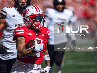 Wisconsin Badgers wide receiver Trech Kekahuna #2 outruns the Purdue Boilermakers defense for a touchdown at Camp Randall Stadium in Madison...