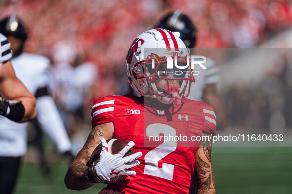 Wisconsin Badgers wide receiver Trech Kekahuna #2 outruns the Purdue Boilermakers defense for a touchdown at Camp Randall Stadium in Madison...