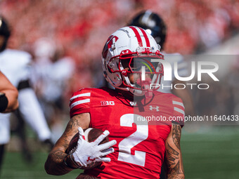 Wisconsin Badgers wide receiver Trech Kekahuna #2 outruns the Purdue Boilermakers defense for a touchdown at Camp Randall Stadium in Madison...