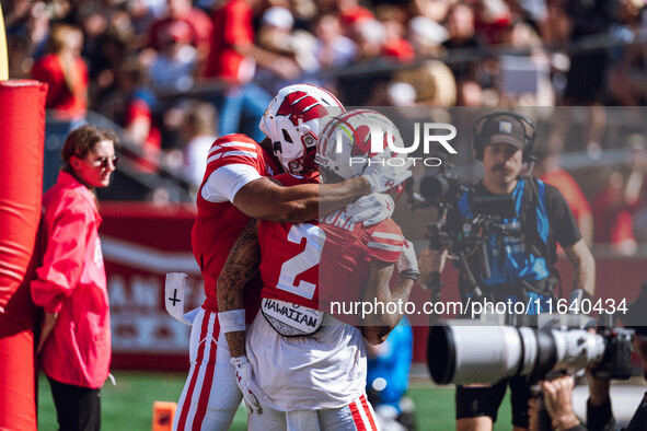 Wisconsin Badgers wide receiver Trech Kekahuna #2 outruns the Purdue Boilermakers defense for a touchdown at Camp Randall Stadium in Madison...