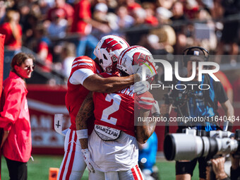 Wisconsin Badgers wide receiver Trech Kekahuna #2 outruns the Purdue Boilermakers defense for a touchdown at Camp Randall Stadium in Madison...