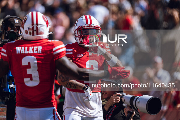 Wisconsin Badgers wide receiver Trech Kekahuna #2 outruns the Purdue Boilermakers defense for a touchdown at Camp Randall Stadium in Madison...