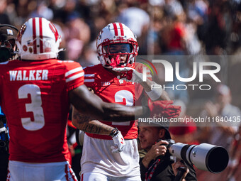 Wisconsin Badgers wide receiver Trech Kekahuna #2 outruns the Purdue Boilermakers defense for a touchdown at Camp Randall Stadium in Madison...