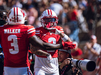 Wisconsin Badgers wide receiver Trech Kekahuna #2 outruns the Purdue Boilermakers defense for a touchdown at Camp Randall Stadium in Madison...