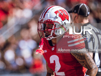 Wisconsin Badgers wide receiver Trech Kekahuna #2 outruns the Purdue Boilermakers defense for a touchdown at Camp Randall Stadium in Madison...