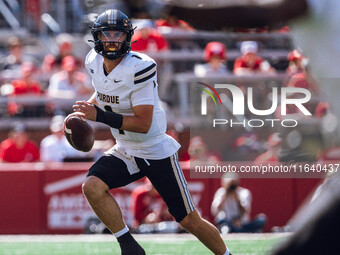 Purdue Boilermakers quarterback Hudson Card #1 looks downfield for an open receiver against the Wisconsin Badgers at Camp Randall Stadium in...