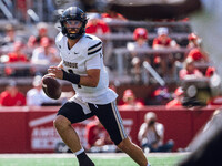 Purdue Boilermakers quarterback Hudson Card #1 looks downfield for an open receiver against the Wisconsin Badgers at Camp Randall Stadium in...