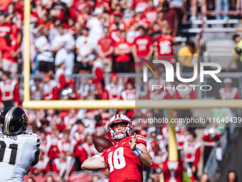 Wisconsin Badgers quarterback Braedyn Locke #18 throws a deep pass against the Purdue Boilermakers at Camp Randall Stadium in Madison, Wisco...