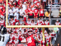 Wisconsin Badgers quarterback Braedyn Locke #18 throws a deep pass against the Purdue Boilermakers at Camp Randall Stadium in Madison, Wisco...