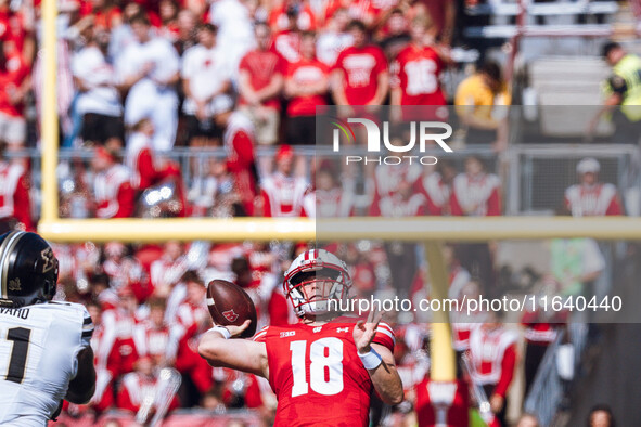 Wisconsin Badgers quarterback Braedyn Locke #18 throws a deep pass against the Purdue Boilermakers at Camp Randall Stadium in Madison, Wisco...