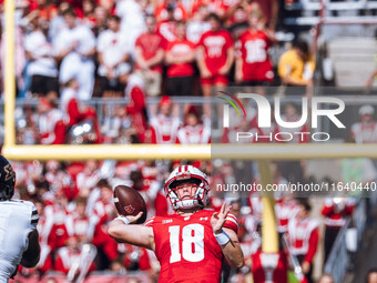 Wisconsin Badgers quarterback Braedyn Locke #18 throws a deep pass against the Purdue Boilermakers at Camp Randall Stadium in Madison, Wisco...