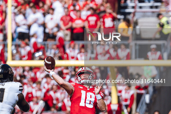 Wisconsin Badgers quarterback Braedyn Locke #18 throws a deep pass against the Purdue Boilermakers at Camp Randall Stadium in Madison, Wisco...