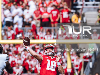 Wisconsin Badgers quarterback Braedyn Locke #18 throws a deep pass against the Purdue Boilermakers at Camp Randall Stadium in Madison, Wisco...