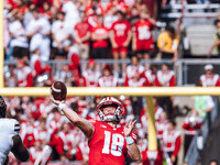 Wisconsin Badgers quarterback Braedyn Locke #18 throws a deep pass against the Purdue Boilermakers at Camp Randall Stadium in Madison, Wisco...