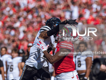 Purdue defensive back Nyland Green #2 defends Wisconsin Badgers wide receiver Quincy Burroughs #5 at Camp Randall Stadium in Madison, Wiscon...