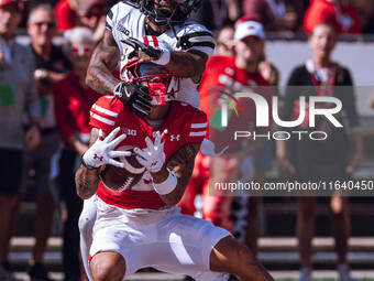 Wisconsin Badgers wide receiver Trech Kekahuna #2 catches a touchdown pass against the Purdue Boilermakers at Camp Randall Stadium in Madiso...