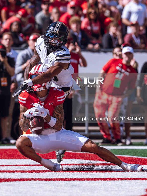 Wisconsin Badgers wide receiver Trech Kekahuna #2 catches a touchdown pass against the Purdue Boilermakers at Camp Randall Stadium in Madiso...