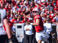 Wisconsin Badgers quarterback Braedyn Locke #18 throws a pass while on the run against the Purdue Boilermakers at Camp Randall Stadium in Ma...