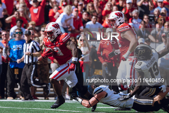 Wisconsin Badgers running back Tawee Walker #3 escapes the Purdue Boilermakers defense for a touchdown at Camp Randall Stadium in Madison, W...