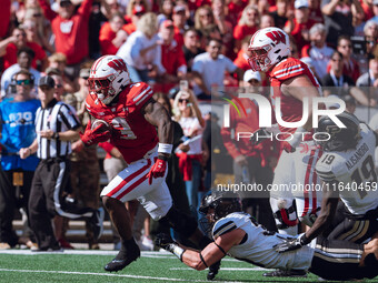 Wisconsin Badgers running back Tawee Walker #3 escapes the Purdue Boilermakers defense for a touchdown at Camp Randall Stadium in Madison, W...